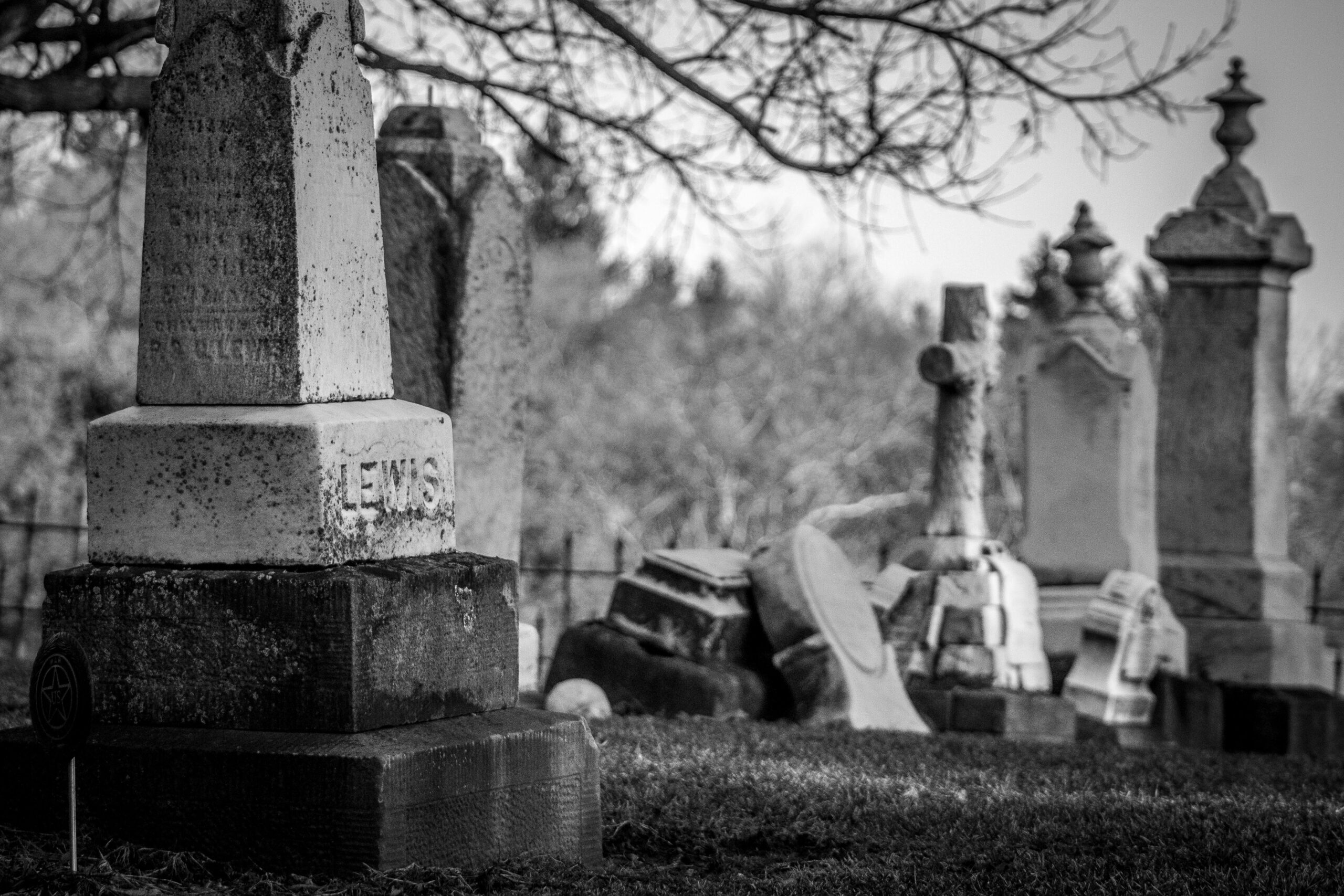 Daily Joke: Man Leaving a Cemetery Notices Another Man Kneeling at a Grave